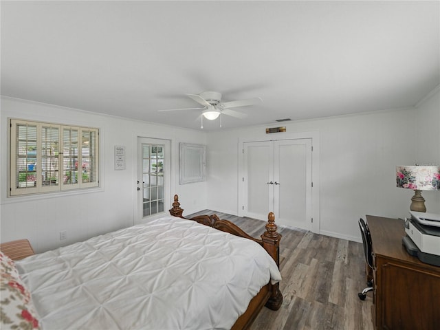140 Morrow Cir, Brandon, FL 33510 - bedroom featuring wood finished floors, an office area, ceiling fan, a closet, and crown molding