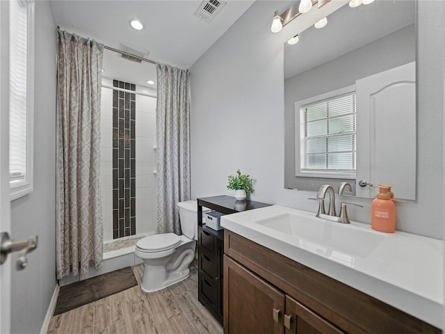 140 Morrow Cir, Brandon, FL 33510 - full bathroom featuring vanity, toilet, wood finished floors, tiled shower, and recessed lighting