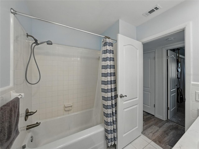 140 Morrow Cir, Brandon, FL 33510 - full bathroom with shower / bath combination with curtain and wood finished floors
