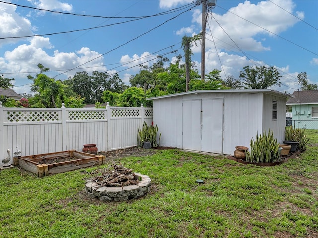 140 Morrow Cir, Brandon, FL 33510 - view of yard with a fire pit and a vegetable garden