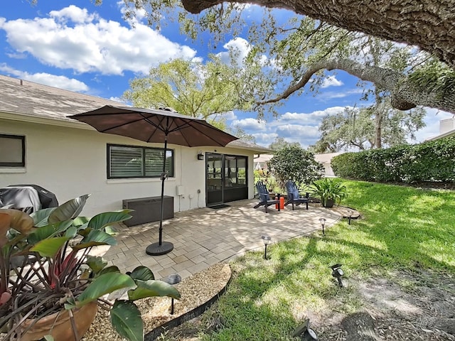3504 Wedge Way, New Port Richey, FL 34655 - rear view of property with a patio, stucco siding, and a yard