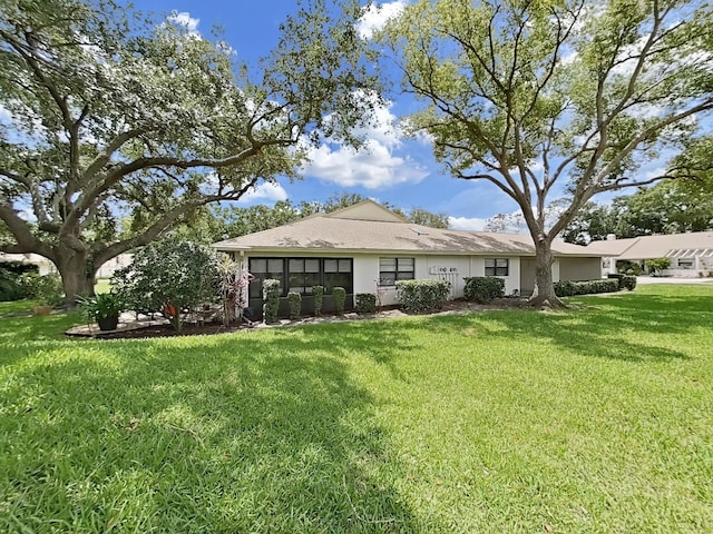 3504 Wedge Way, New Port Richey, FL 34655 - rear view of house with a yard and stucco siding