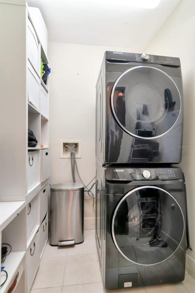 111 N 12th St Unit 1805, Tampa, FL 33602 - laundry room with stacked washer / dryer and light tile patterned floors