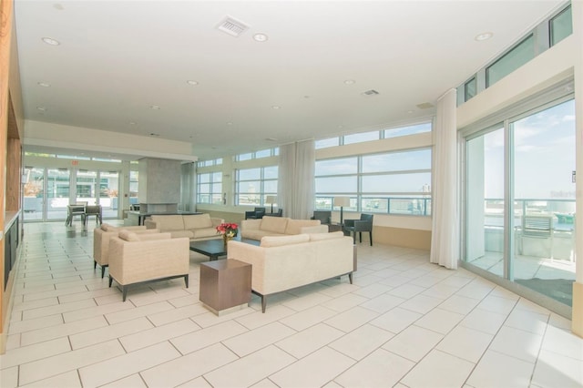 111 N 12th St Unit 1805, Tampa, FL 33602 - living room with plenty of natural light, light tile patterned floors, and recessed lighting