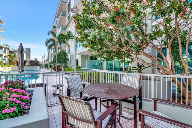 111 N 12th St Unit 1805, Tampa, FL 33602 - wooden deck with outdoor dining space and a community pool