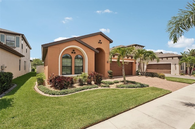 13128 Foxtail Fern Dr, Riverview, FL 33579 - mediterranean / spanish-style house with decorative driveway, stucco siding, a garage, and a front yard