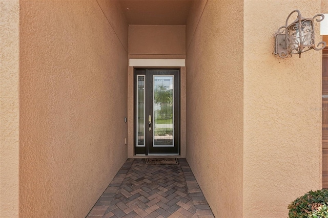 13128 Foxtail Fern Dr, Riverview, FL 33579 - doorway to property featuring stucco siding