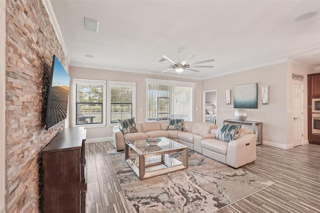 13128 Foxtail Fern Dr, Riverview, FL 33579 - living area with ceiling fan, crown molding, and wood finished floors