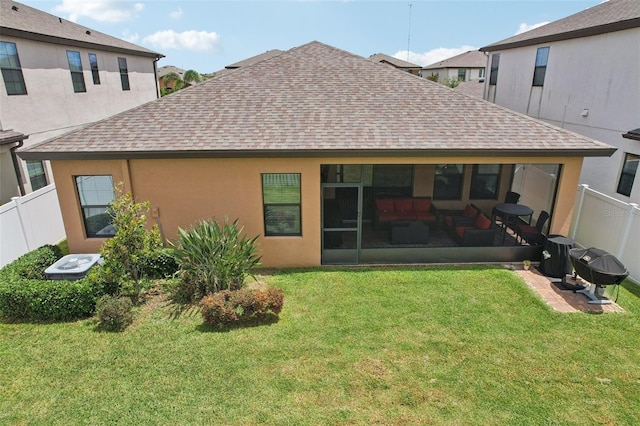 13128 Foxtail Fern Dr, Riverview, FL 33579 - rear view of property featuring a shingled roof, a fenced backyard, a sunroom, and stucco siding