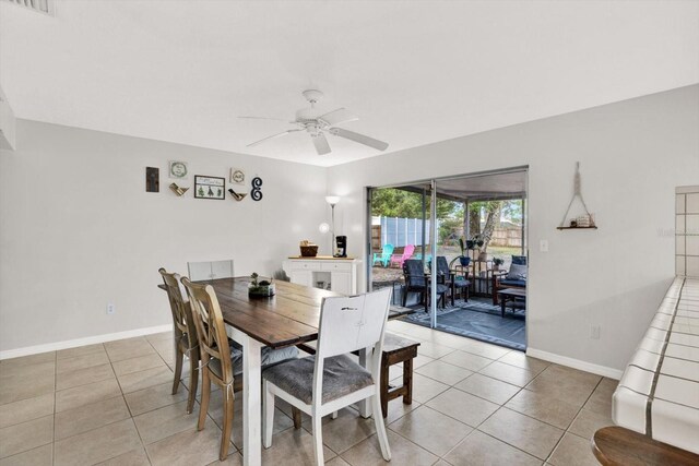 3615 Greatwood Ct, Land O Lakes, FL 34639 - dining area with light tile patterned floors, a ceiling fan, and baseboards