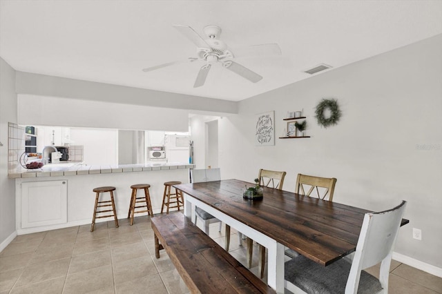 3615 Greatwood Ct, Land O Lakes, FL 34639 - dining area with light tile patterned flooring, ceiling fan, and baseboards