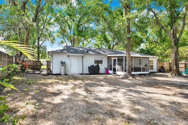 3615 Greatwood Ct, Land O Lakes, FL 34639 - back of house with a sunroom and a fenced backyard