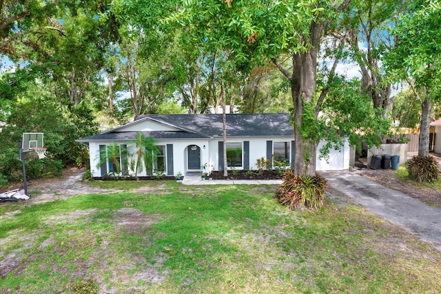 3615 Greatwood Ct, Land O Lakes, FL 34639 - ranch-style home featuring driveway, stucco siding, an attached garage, and a shingled roof
