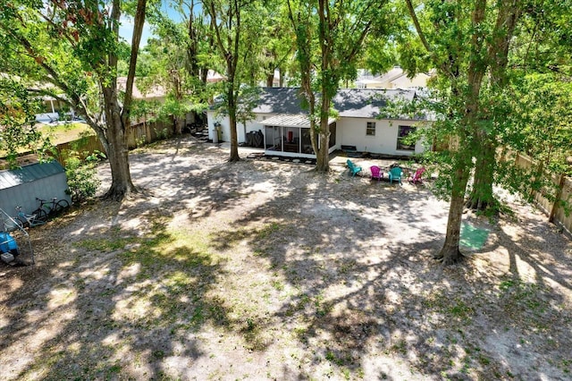 3615 Greatwood Ct, Land O Lakes, FL 34639 - rear view of house with a sunroom and a fenced backyard