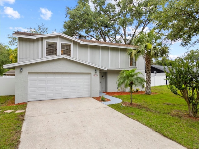 4509 Grainary Ave, Tampa, FL 33624 - view of front of home with a garage, concrete driveway, and stucco siding