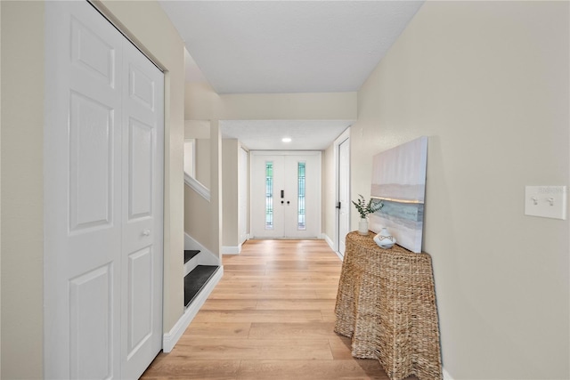 4509 Grainary Ave, Tampa, FL 33624 - entrance foyer with light wood-type flooring and baseboards