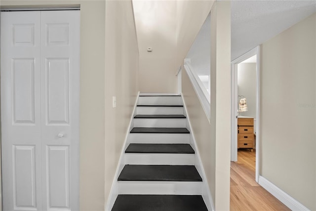 4509 Grainary Ave, Tampa, FL 33624 - stairs with wood finished floors and baseboards