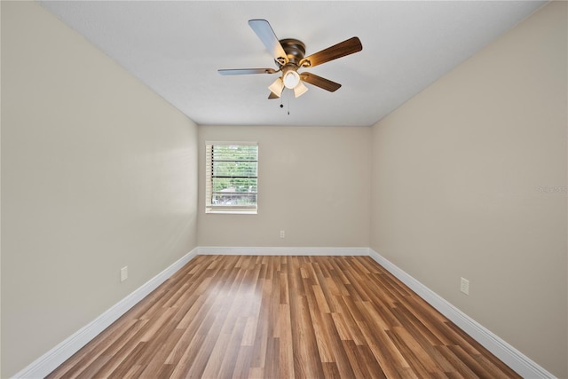 4509 Grainary Ave, Tampa, FL 33624 - unfurnished room featuring baseboards, light wood finished floors, and ceiling fan