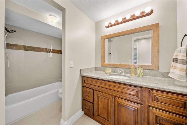 4509 Grainary Ave, Tampa, FL 33624 - bathroom with vanity, toilet, bathtub / shower combination, tile patterned flooring, and baseboards