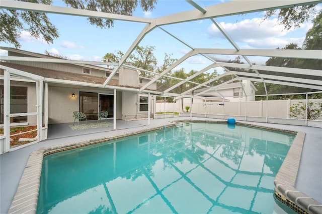 4509 Grainary Ave, Tampa, FL 33624 - view of swimming pool with a patio area and glass enclosure