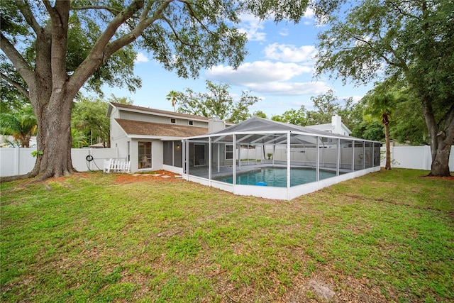 4509 Grainary Ave, Tampa, FL 33624 - back of house with stucco siding and glass enclosure