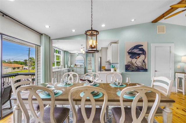 4916 Palmetto Point Dr, Palmetto, FL 34221 - dining space featuring light wood-type flooring, recessed lighting, and a chandelier