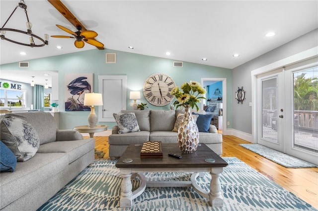 4916 Palmetto Point Dr, Palmetto, FL 34221 - living area with wood finished floors, lofted ceiling, recessed lighting, baseboards, and french doors