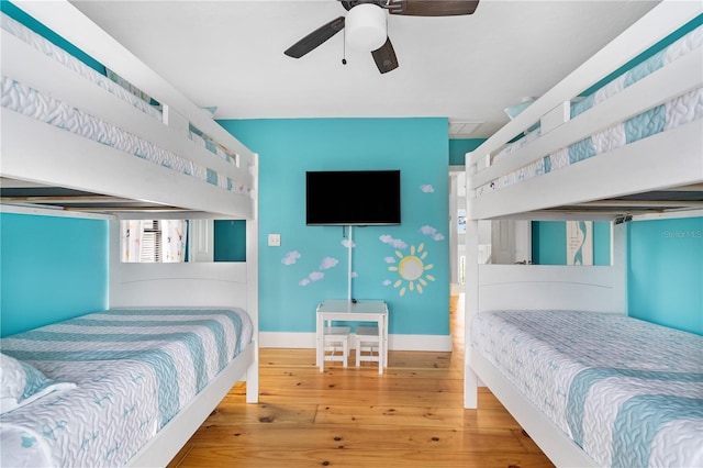4916 Palmetto Point Dr, Palmetto, FL 34221 - bedroom with wood-type flooring, baseboards, and ceiling fan
