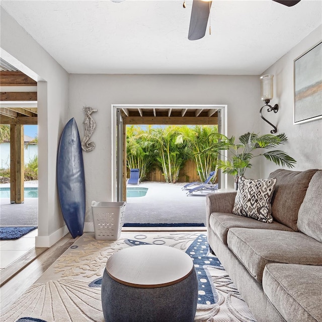 4916 Palmetto Point Dr, Palmetto, FL 34221 - living room with a ceiling fan, wood finished floors, and baseboards