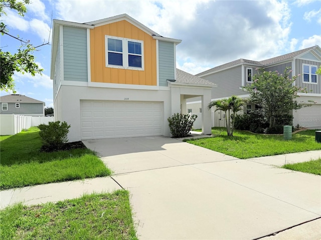 13118 Zolo Springs Cir, Riverview, FL 33579 - view of front of property with board and batten siding, a garage, and driveway