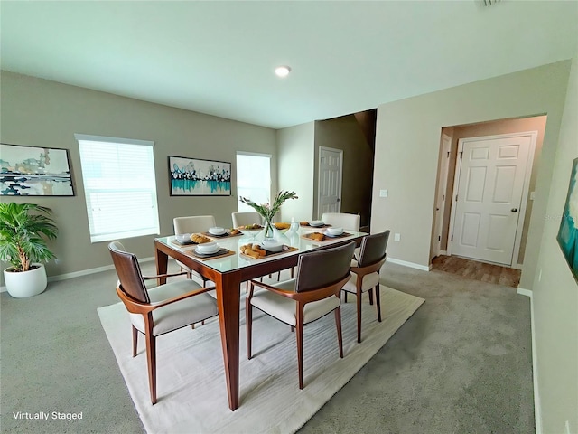13118 Zolo Springs Cir, Riverview, FL 33579 - dining space featuring baseboards, light colored carpet, plenty of natural light, and recessed lighting