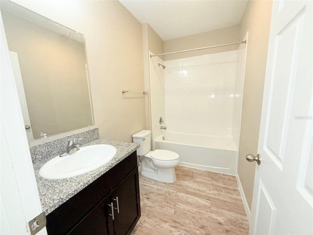 13118 Zolo Springs Cir, Riverview, FL 33579 - bathroom with wood finished floors, toilet, vanity, and bathtub / shower combination