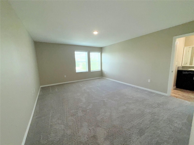 13118 Zolo Springs Cir, Riverview, FL 33579 - carpeted spare room with baseboards and recessed lighting