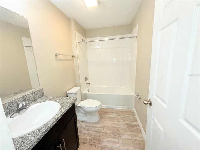 13118 Zolo Springs Cir, Riverview, FL 33579 - full bathroom featuring wood finished floors, toilet, vanity, and shower / bathtub combination