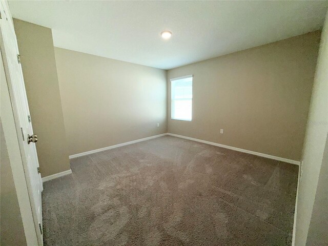 13118 Zolo Springs Cir, Riverview, FL 33579 - unfurnished room with baseboards and carpet floors