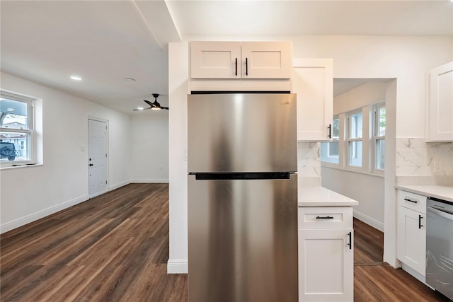 410 Virginia Ave, Madeira Beach, FL 33708 - kitchen featuring appliances with stainless steel finishes, backsplash, white cabinetry, dark wood-style floors, and recessed lighting