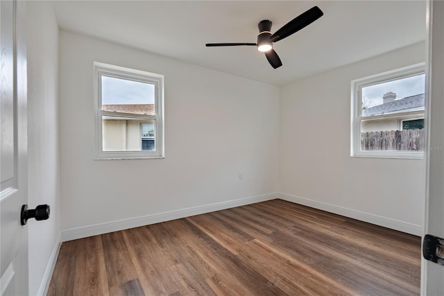 410 Virginia Ave, Madeira Beach, FL 33708 - empty room with wood finished floors, ceiling fan, and baseboards