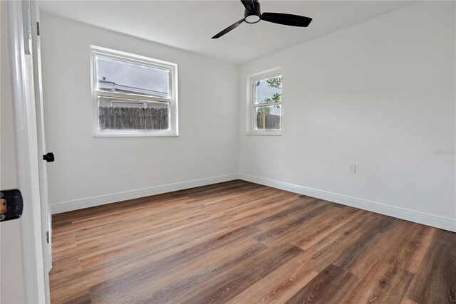 410 Virginia Ave, Madeira Beach, FL 33708 - empty room featuring wood finished floors, ceiling fan, and baseboards