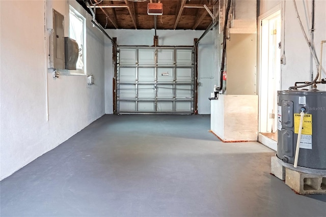 410 Virginia Ave, Madeira Beach, FL 33708 - garage featuring electric water heater, a garage door opener, and electric panel