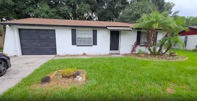3513 Danny Bryan Blvd, Tampa, FL 33619 - single story home with stucco siding, a front lawn, concrete driveway, and a garage