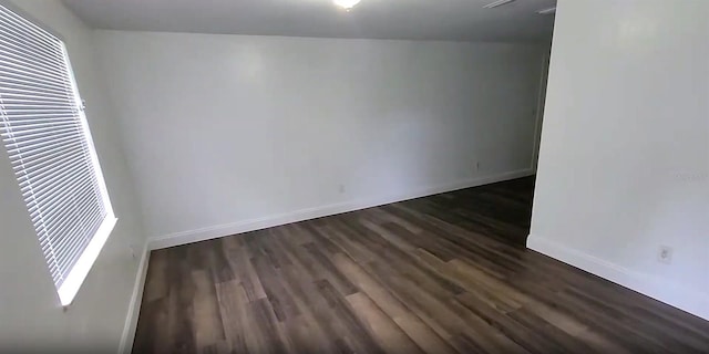 3513 Danny Bryan Blvd, Tampa, FL 33619 - empty room with dark wood-style flooring and baseboards