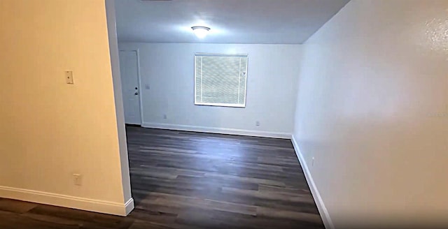 3513 Danny Bryan Blvd, Tampa, FL 33619 - unfurnished room featuring baseboards and dark wood finished floors