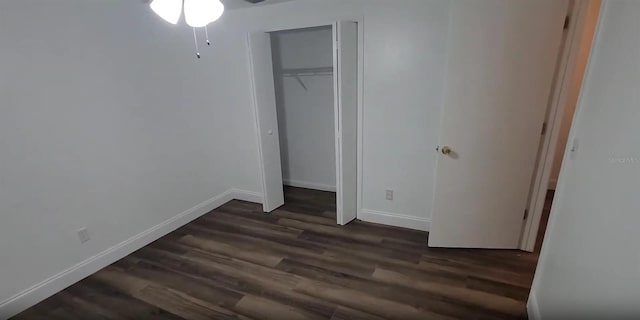 3513 Danny Bryan Blvd, Tampa, FL 33619 - unfurnished bedroom with dark wood-type flooring and a closet