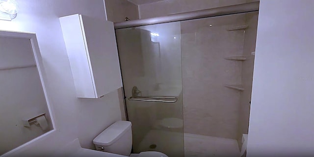 3513 Danny Bryan Blvd, Tampa, FL 33619 - bathroom featuring a stall shower and toilet