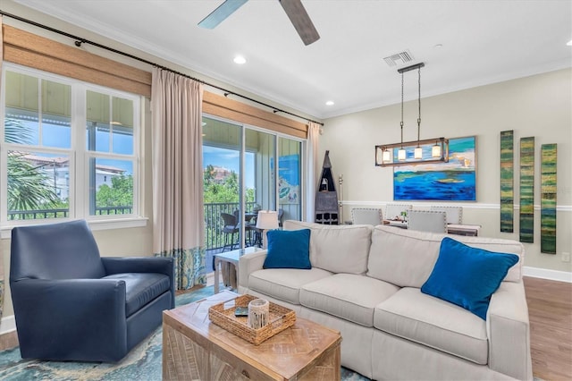 204 Haven Beach Ct, Indian Rocks Beach, FL 33785 - living area featuring crown molding, ceiling fan, wood finished floors, and recessed lighting