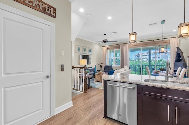 204 Haven Beach Ct, Indian Rocks Beach, FL 33785 - kitchen featuring dishwasher, dark brown cabinetry, ceiling fan, light wood-style floors, and light stone counters
