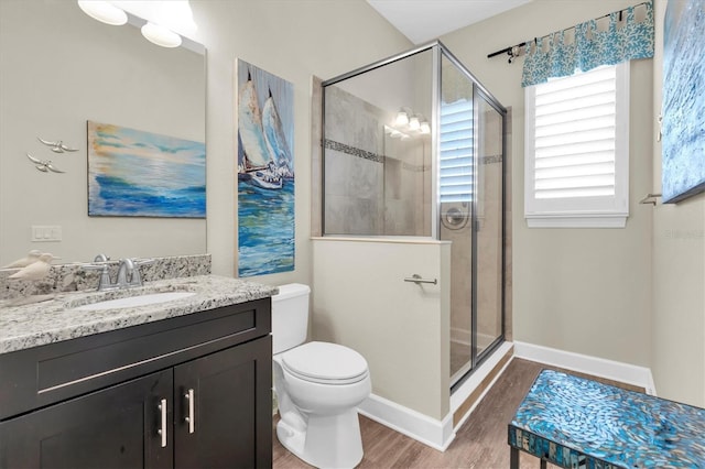 204 Haven Beach Ct, Indian Rocks Beach, FL 33785 - full bath with wood finished floors, a shower stall, and vanity
