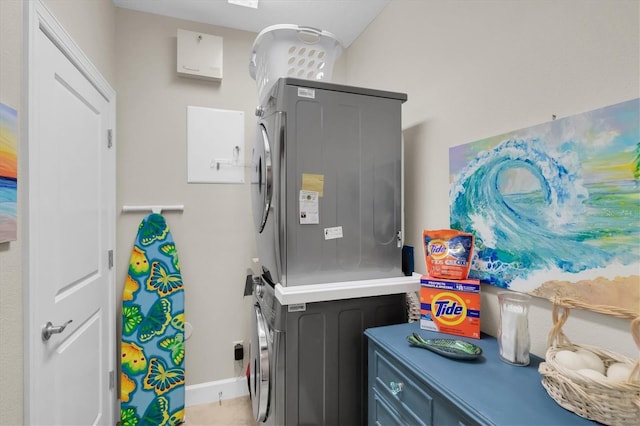 204 Haven Beach Ct, Indian Rocks Beach, FL 33785 - laundry room with estacked washer and dryer and cabinet space