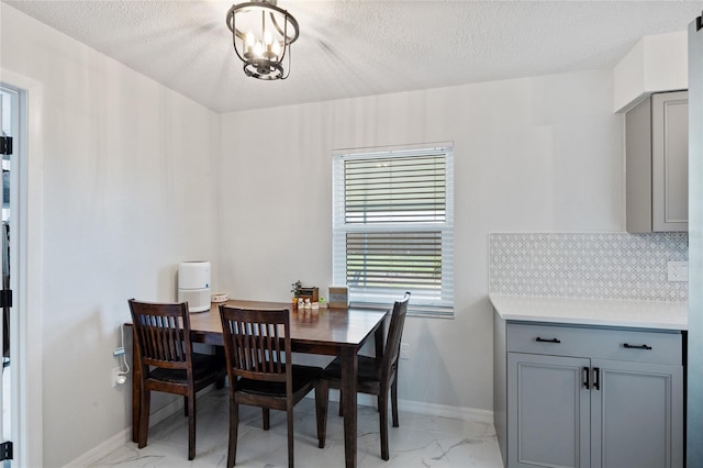 3983 Shay Dr, Bartow, FL 33830 - dining room featuring light marble finish floors and a textured ceiling