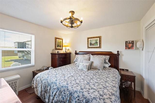 3983 Shay Dr, Bartow, FL 33830 - bedroom featuring a chandelier and dark wood finished floors